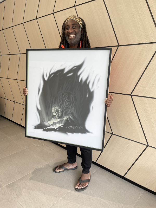 Moses from Pride Lands holding the artwork Mana