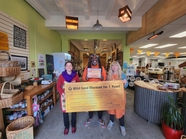 Pride Lands kids on a Social Development visit to an a refill shop and café